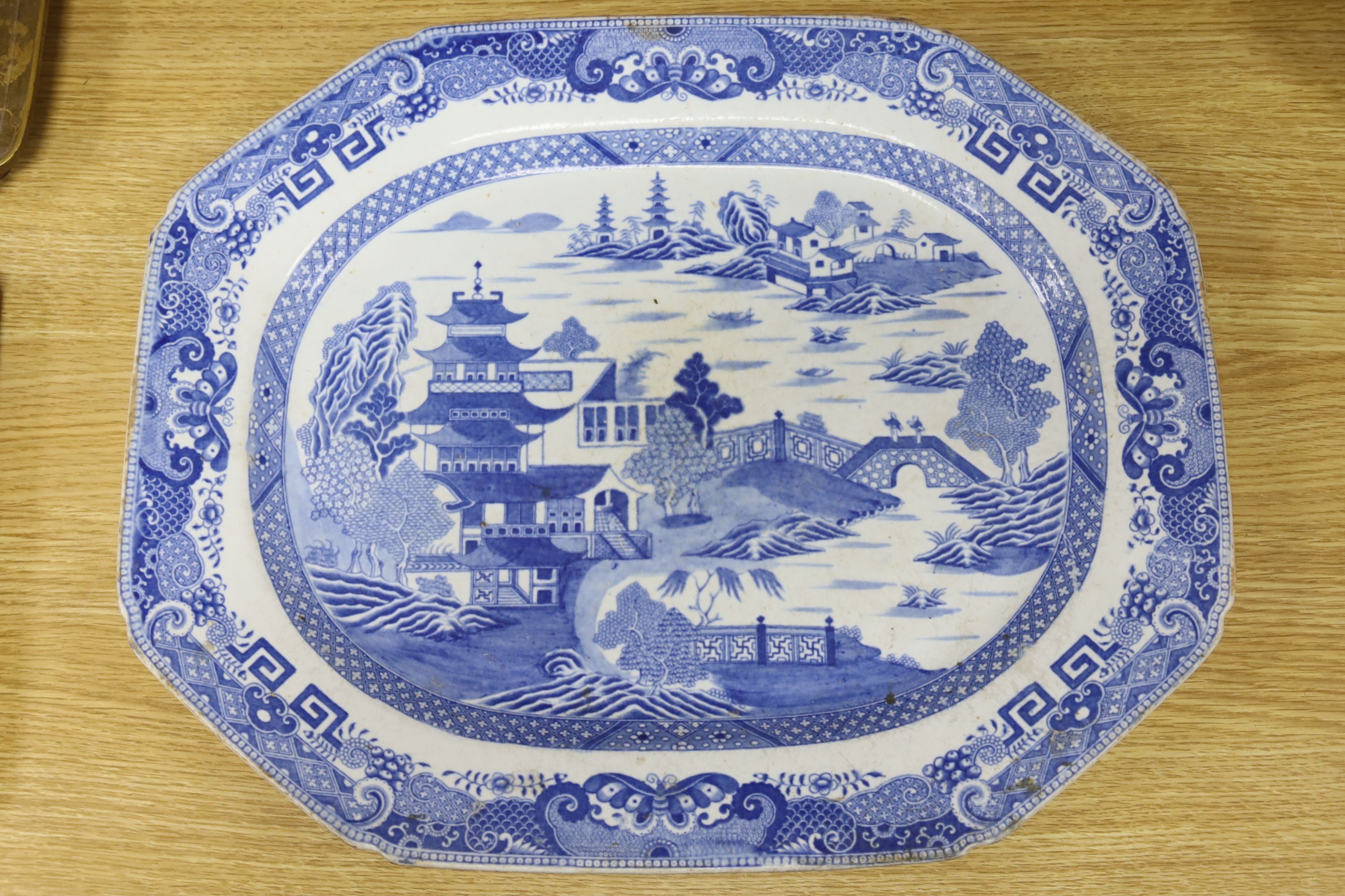 A blue and white meat dish decorated with a Chinese landscape pattern, and a Victorian blue and white tureen, cover and stand, height 17cm